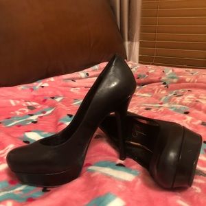 Black platform pumps